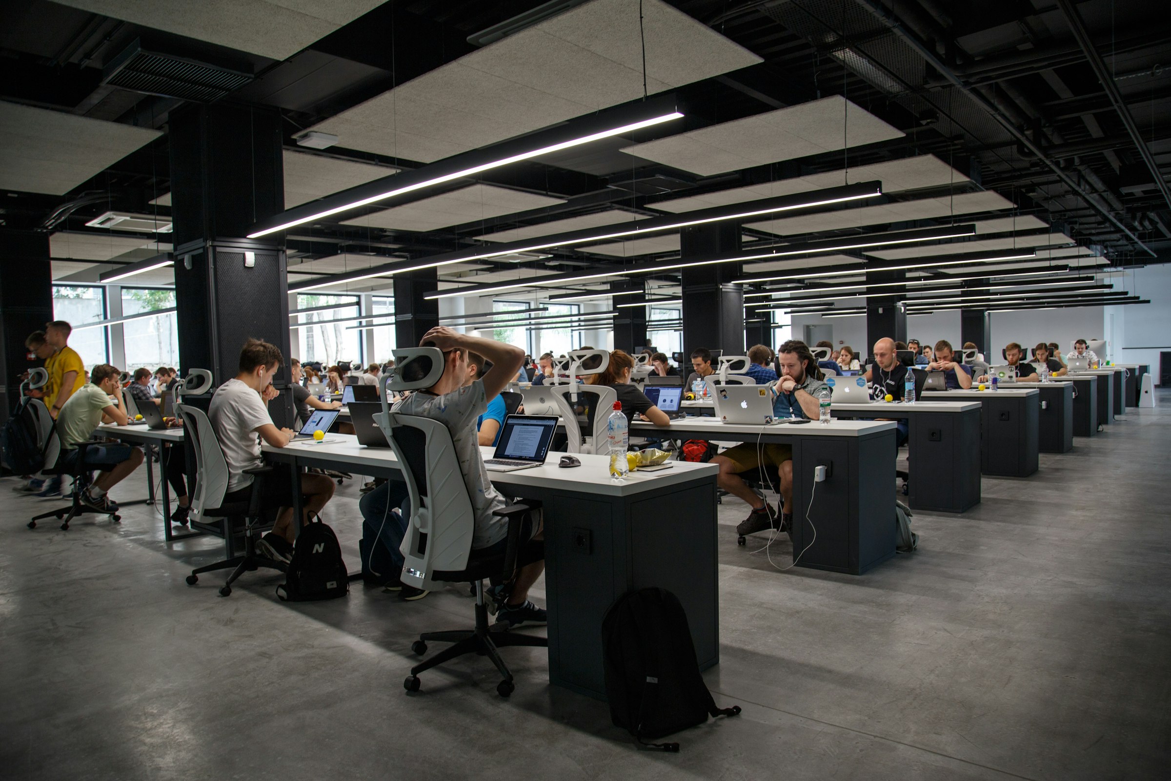 A collaborative brand strategy workshop with notes and planning materials, representing clarity, positioning and business direction before visual design.
